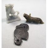 A Chinese grey stone pelican pendant, soapstone crane group and a greenstone Buddhist lion, the