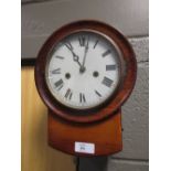 A drop dial wall clock with bell strike, 26cm high