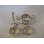 Two silver napkin rings by Deakin & Francis, Birmingham 1920 and 1923, of rectangular engine