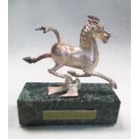 A miniture cast silver replica statue of the flying horse of Gansu, a famous Chinese bronze