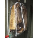 Three fur jackets and a stole (one possibly mink)