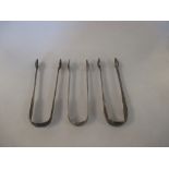 Three George III silver sugar tongs, total weight 5.79ozt