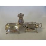 A three piece silver condiment set by Walker and Hall, London 1937, of rectangular form with gadroon