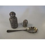 A silver scent bottle, a silver miniature pepper caster and a silver spoon