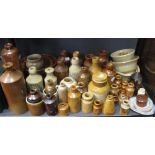 A collection of Doulton & other stoneware bottles & jars, including Schwepps & other advertising,
