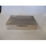 A silver desk cigarette box by James Dixon & Son Birmingham 1939, rectangular, plain with slightly