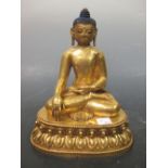 A gilded bronze buddha, 25cm high