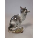 A Meissen figure of a cat with a fish, 18cm high