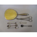 A silver and yellow enamel hand mirror, Birmingham 1935, a silver salt spoon, four Eastern metal