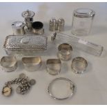 A small quantity of silver wares, comprising of napkin rings, silver mounted boxes, cruets etc