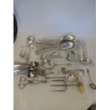 A collection of silver flatware including five tablespoons, two toddy ladles, a pierced ladle,