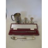 A silver tankard, a pair of silver dwarf candlesticks, a cased silver letter opener and sugar