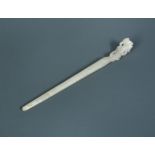 A Chinese mutton fat jade hair pin, 16cm (6.25 in) wide