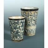 Two Martin Brothers stoneware beakers, the larger with silver mounted rim above grass heads, an