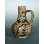 Arthur Barlow for Doulton Lambeth, a stoneware jug, with stylised leaf decoration, the handle with
