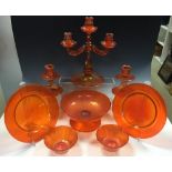 A collection of Venetian orange glasswares, circa 1930's, comprising a three-branch candelabra, a