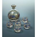 A late 19th century Russian glass vodka set, comprising decanter of bulbous form and five glasses,