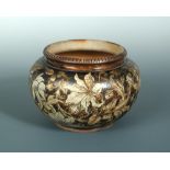 A Martin Brothers stoneware jardiniere, the bulbous body with moulded and incised rim, the body with