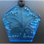 An R. Lalique blue glass pendant, the pentagonal pendant with leaf design, moulded R. Lalique mark