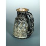 A Martin Brothers stoneware jug, with incised stylised leaf decoration, inscribed to the