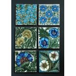 William de Morgan, a collection of fourteen floral decorated tiles, each approximately 15.5cm square