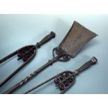 A set of Cotswold school wrought iron fire tools, comprising shovel and two sizes of tongs 90cm (