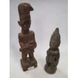 An African tribal figure signed Fakeyne (Hamidi Fakeyne Yoruba; and another figure, largest figure