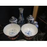 A pair of Chinese blue and white meiping, another vase, two bowls with stands, a Chinese tea caddy