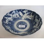 A Chinese bowl, the blue and white exterior decorated with flowers, the interior in polychrome