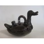 A treacle glaze pottery duck jug, possibly Channakale