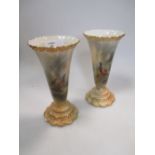 A pair of Royal Worcester vases painted with pheasants and signed by James Stinton, shape number G7