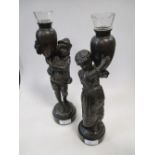 A pair of bronzed base metal figurines, 30cm high