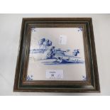 A framed display of three Delft tiles and a blue and white tile (4)