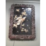 A Japanese black lacquer panel inlaid with an eagle, 73 x 52cm
