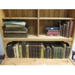 A collection of books and albums in three boxes, including a Japanese postcard album, early 20th