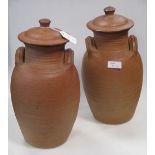 A pair of Winchcombe Pottery jars and covers 33cm high (2)