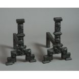 A pair of early 17th century cast iron Andirons, with Tudor rose, crown and goblet moulded