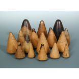 A collection of sixteen 19th century lignum vitae plumber's turnpins, each of the cone shapes on