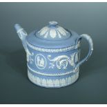 An 18th century Wedgwood jasperware teapot and cover, circa 1780, of circular form, sprigged with