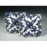Two mid 16th century Iznik 'Dome of the Rock' tiles, each painted in blue on the diagonal with