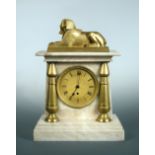 A Regency white marble mantle timepiece, surmounted by an ormolu model of the Sphinx, gilt dial