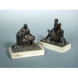 Socrates and Leon of Salamis, a pair of early 19th century bronze figures, seated facing each other,