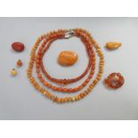 A collection of butterscotch and other vintage amber bead necklaces and jewellery, the first