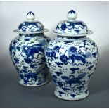 A Chinese blue and white transitional period vase and covers, circa 1700, the baluster body