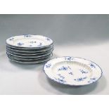A set of eight Caughley blue and white shaped circular dished plates, decorated with scattered