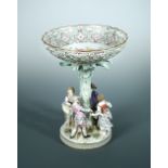 A Meissen figural comport, circa 1890, the circular base mounted with four playful children