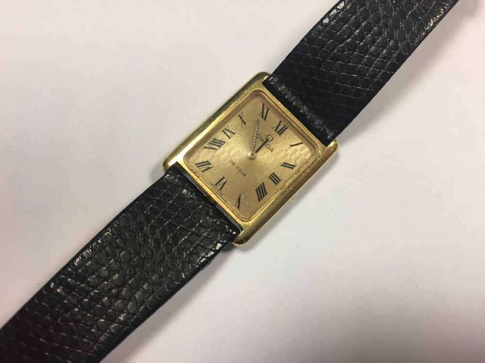 Omega - A gentleman's 18ct gold 'De Ville' wristwatch, the champagne rectangular dial with engine