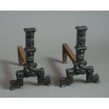 A pair of 16th century cast iron pillar Andirons, with Tudor rose & crown, goblet and fleur de lys