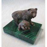 A cold painted bronze model of a bear and cub mounted to a malachite base, the parent standing