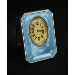 A Swiss silver and enamelled case strut bedside clock, pale blue ground with engine turning and